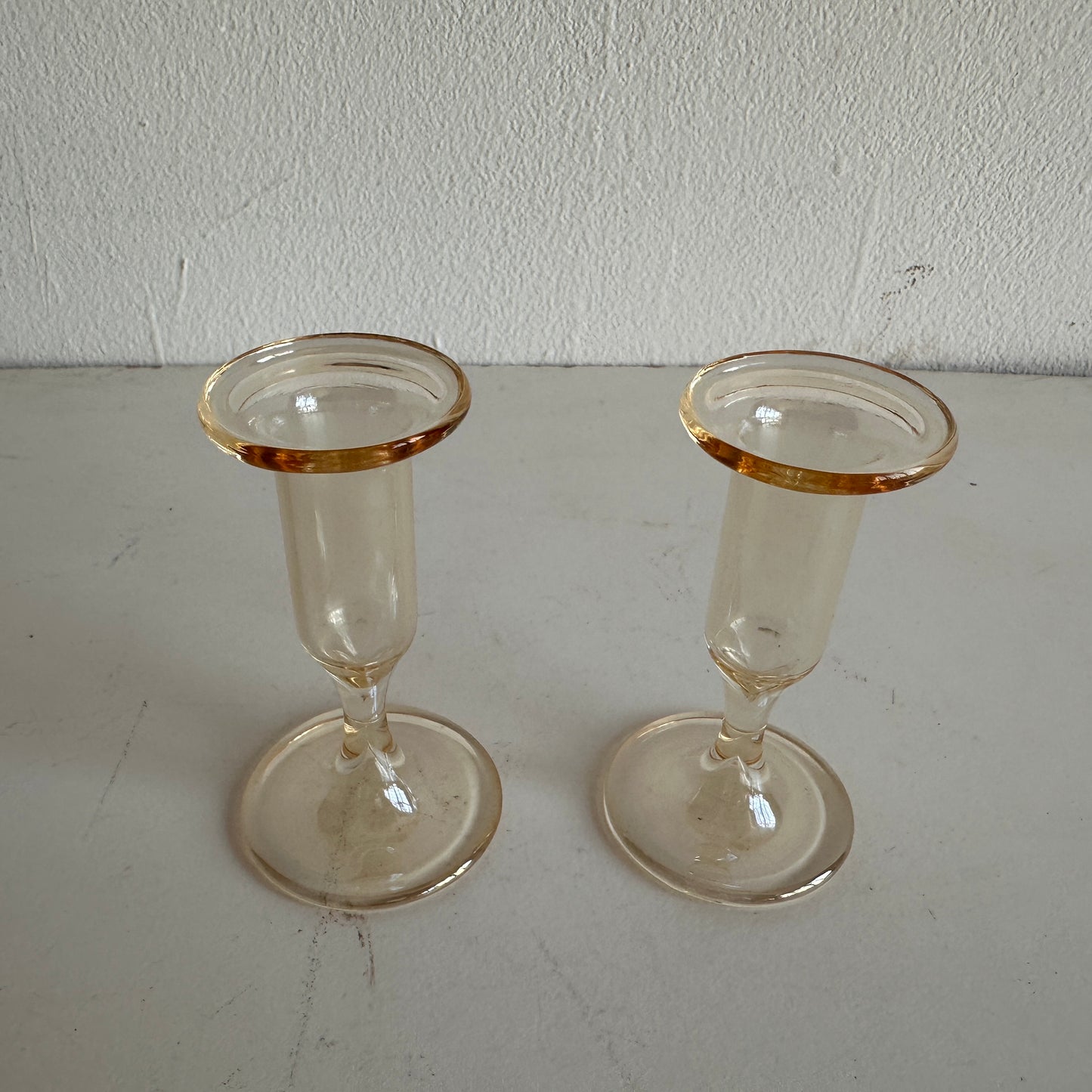 CA006 SET OF TWO AMBER TINTED GLASS TAPER CANDLE HOLDERS