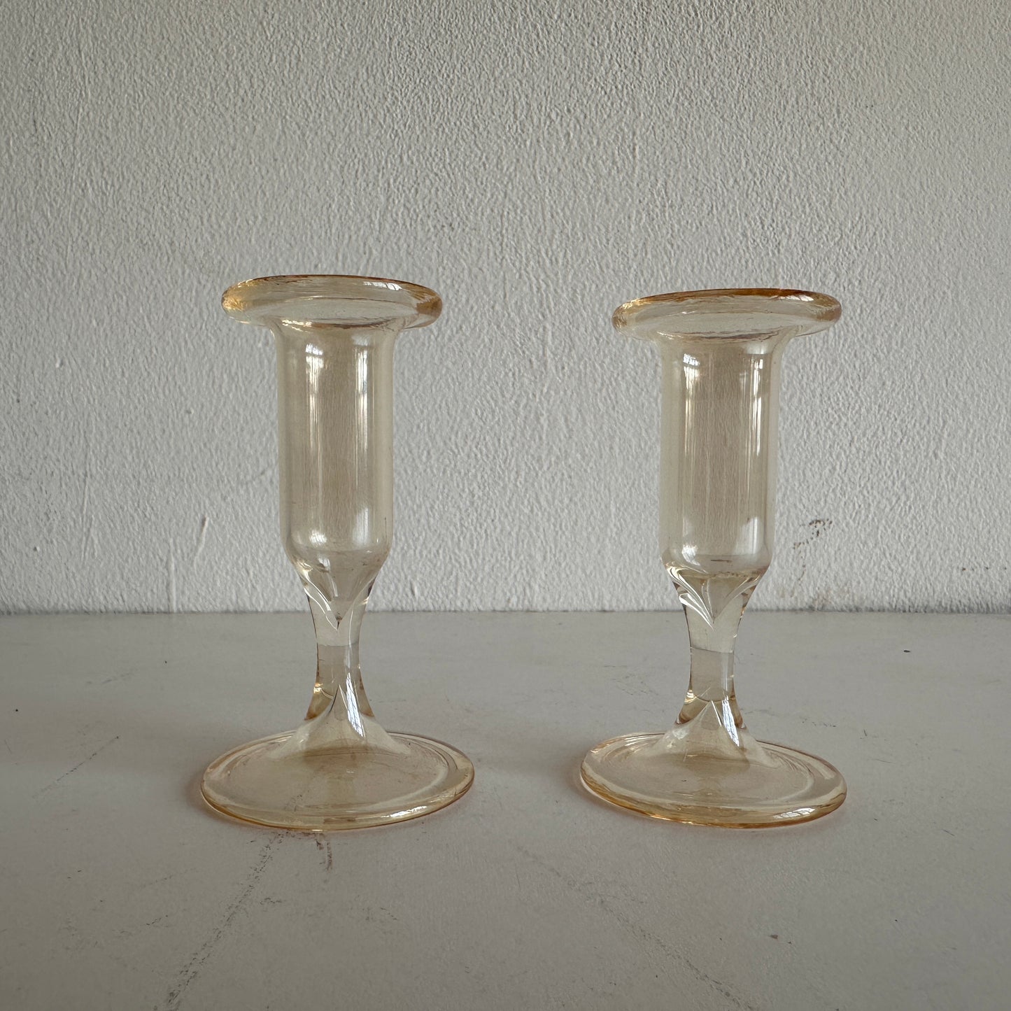 CA006 SET OF TWO AMBER TINTED GLASS TAPER CANDLE HOLDERS