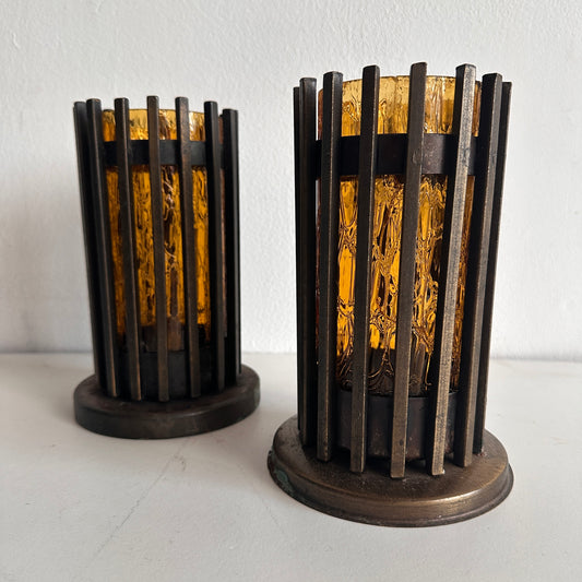 CA012 SET OF TWO BRUTALIST IRON AND AMBER TINTED GLASS PILAR CANDLE HOLDERS