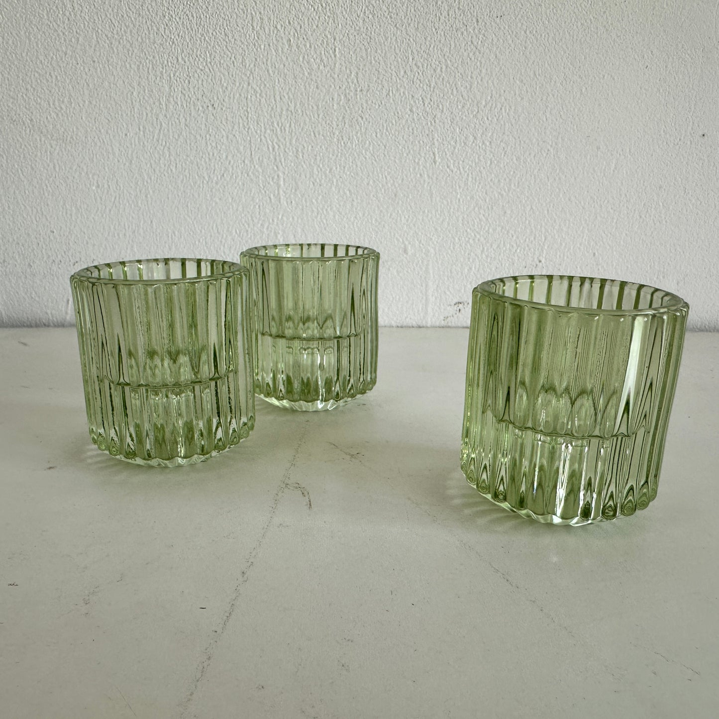 CA027 SET OF THREE GREEN TINTED FLUTED VOTIVE HOLDERS