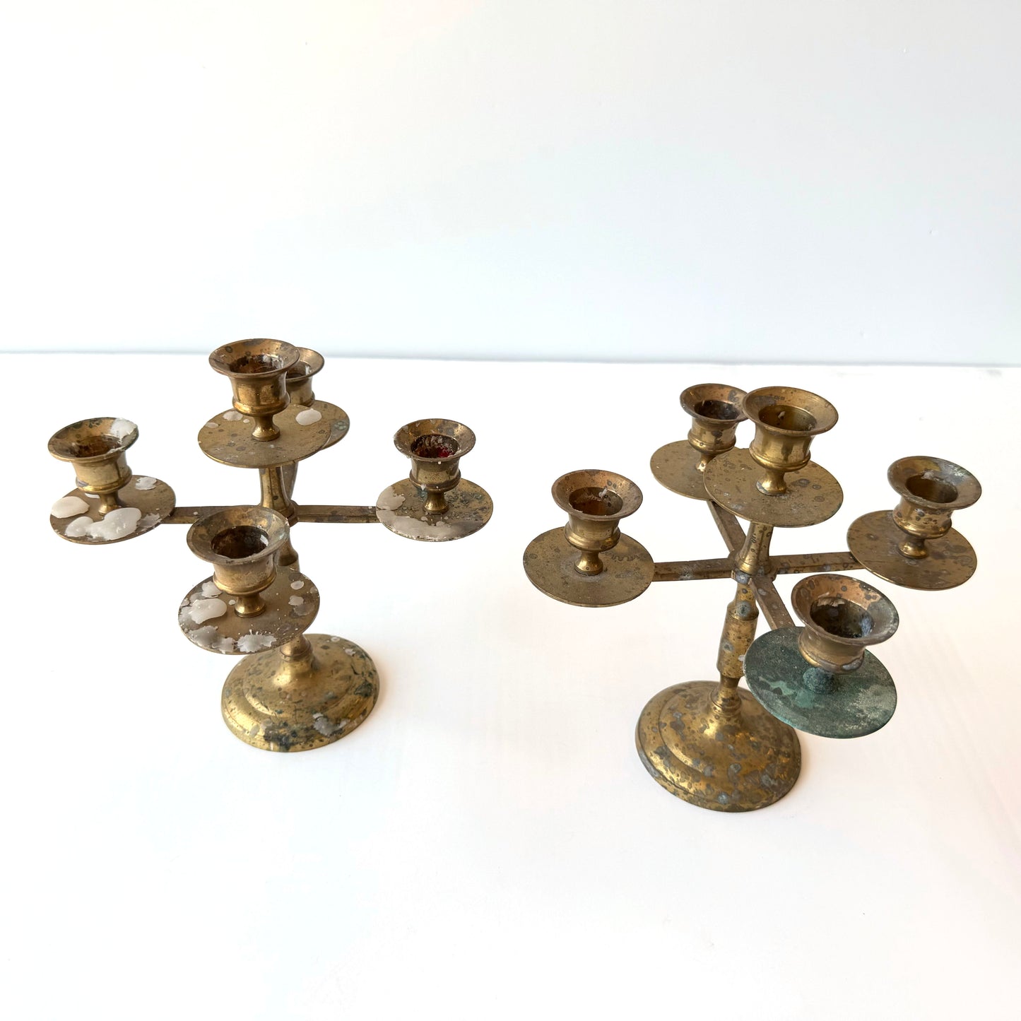 CA049 PAIR OF DISTRESSED BRASS CANDLE STICKS
