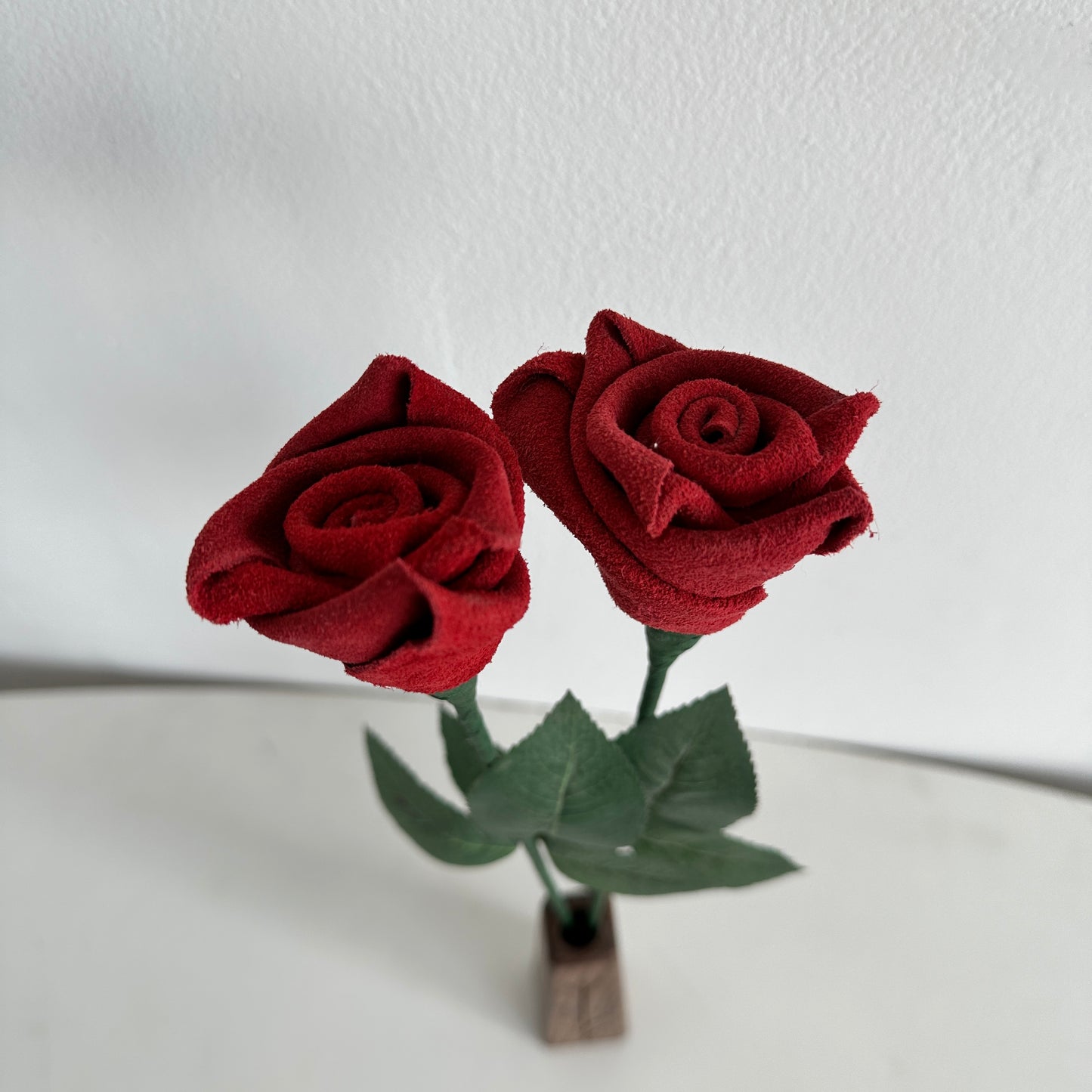 FF005 PAIR OF RED LEATHER FLOWERS AND WOOD VASE