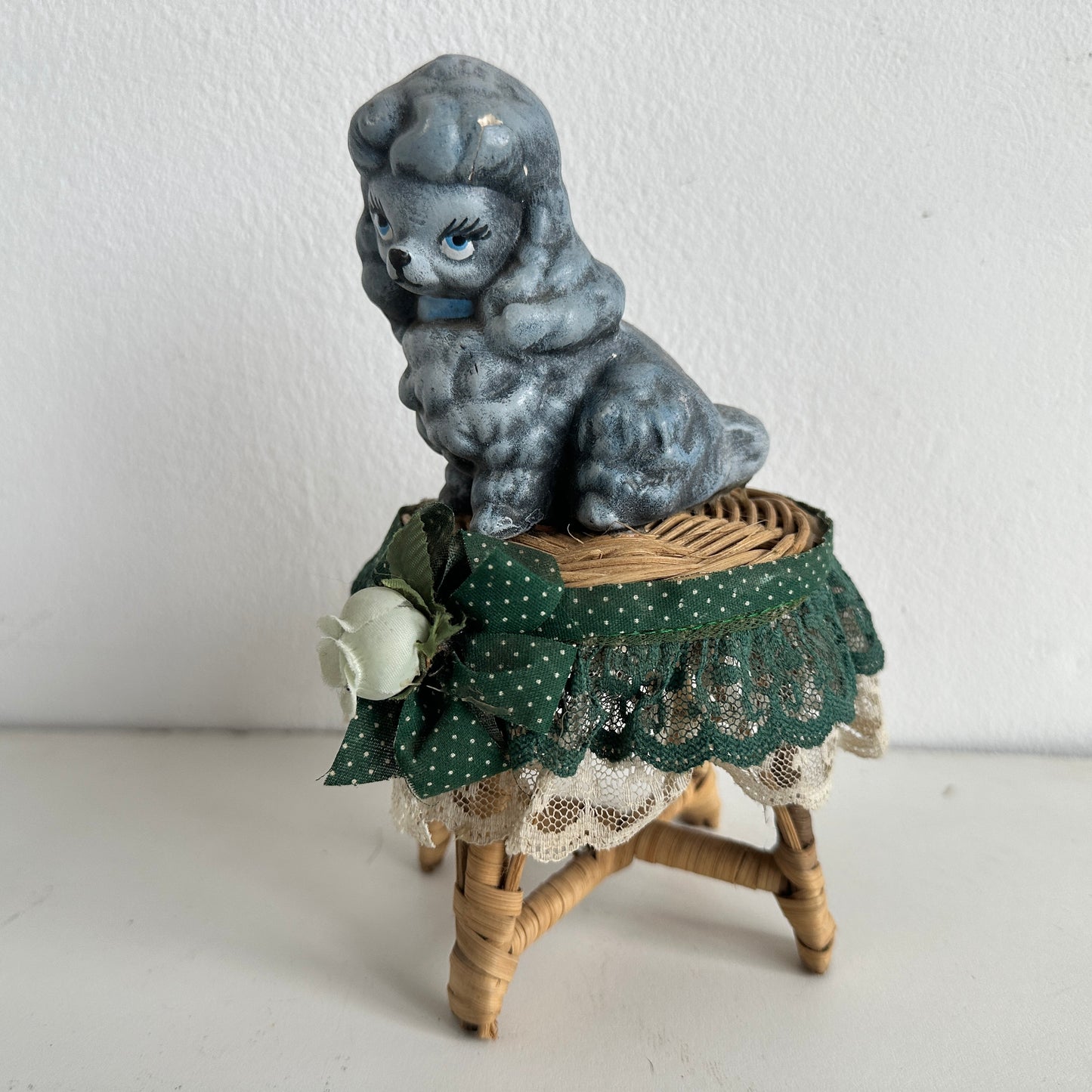 OB036 CHEEKY POODLE ON A TINY RATTAN TABLE