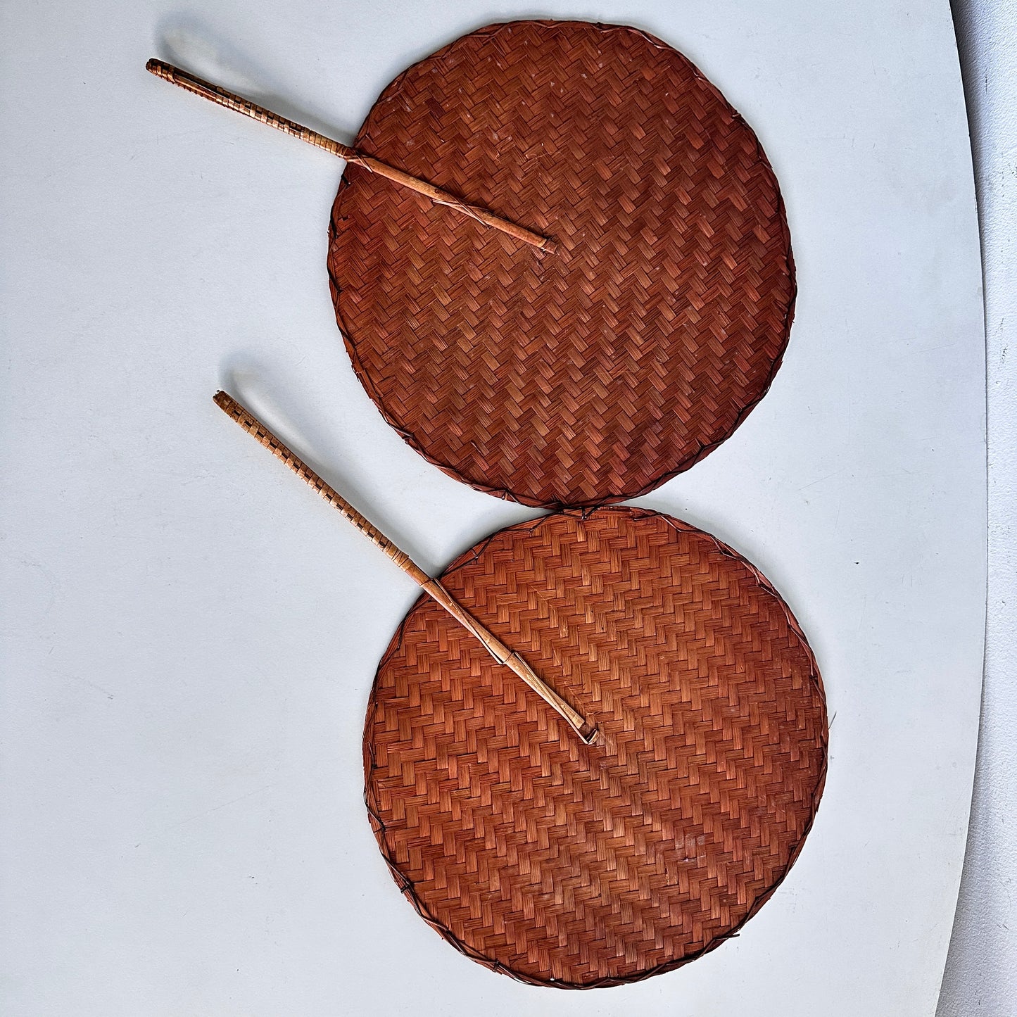 OB065 PAIR OF BAMBOO WOVEN HAND FANS
