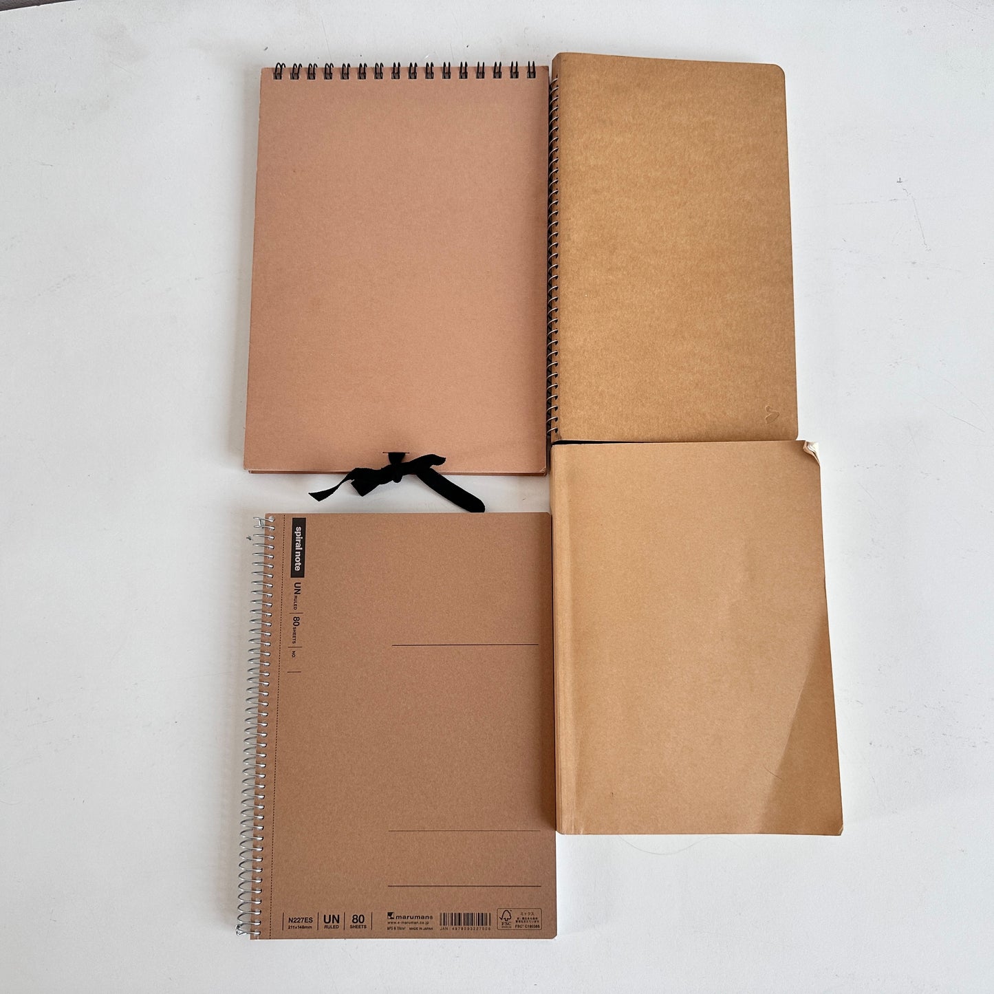 OF011 STACK OF 4 TAN NOTEBOOKS