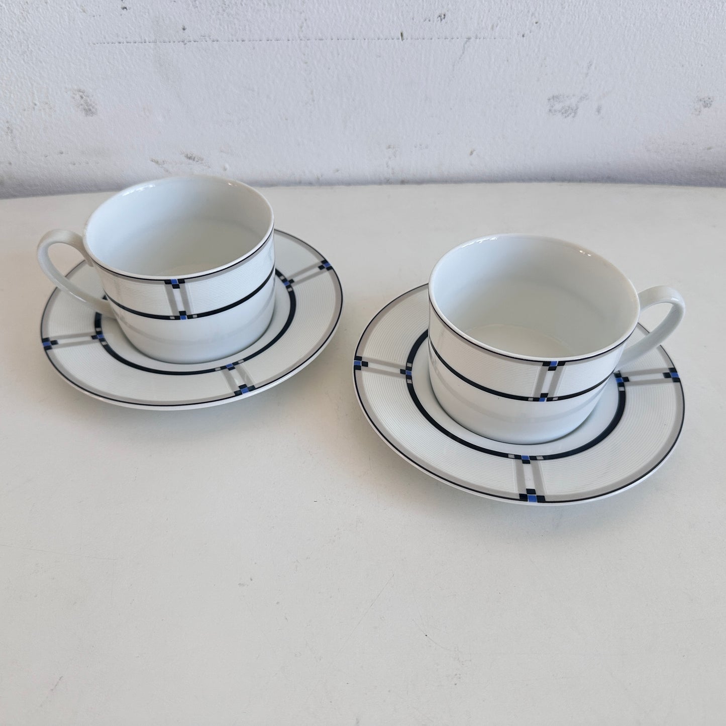 TT153 PAIR OF NOVA GEOMETRIC CUPS AND SAUCERS