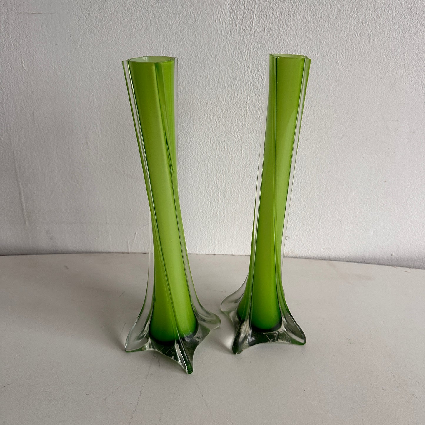 VS027 PAIR OF GREEN GLASS TWIZT VASES