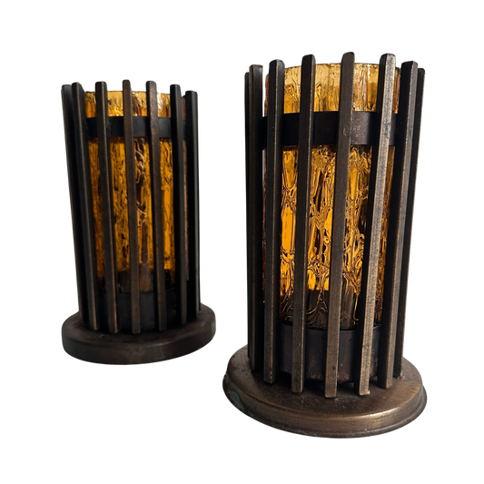 CA012 SET OF TWO BRUTALIST IRON AND AMBER TINTED GLASS PILAR CANDLE HOLDERS