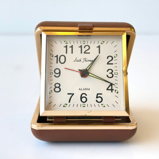 E102 BROWN PLASTIC AND BRASS FOLDING ALARM CLOCK