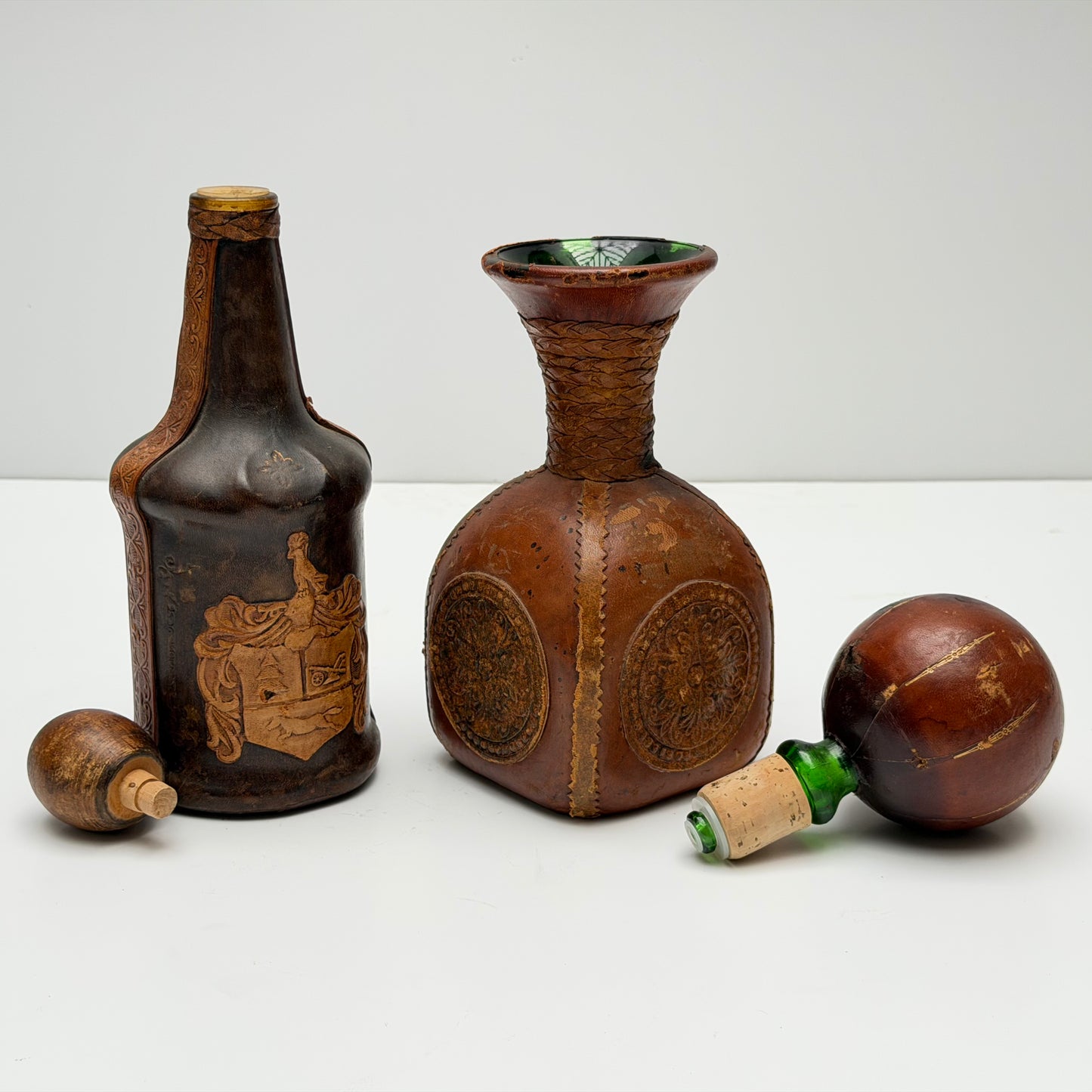 OB102 SET OF TWO LEATHER WRAPPED DECANTERS