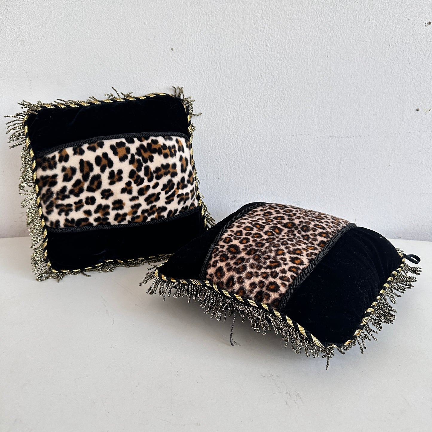 PW025 PAIR OF MINI BLACK & GOLD ANIMAL PRINT PILLOWS