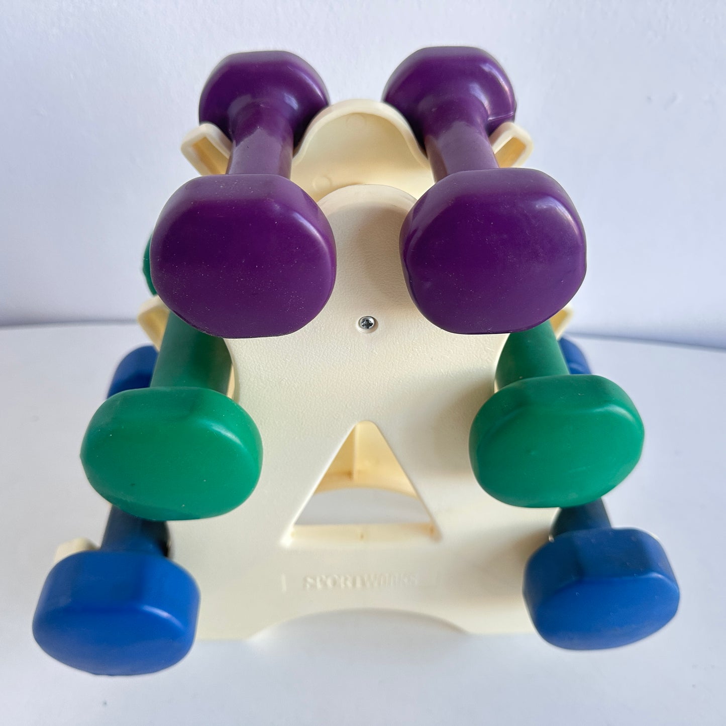 SP032 VINTAGE SPORTWORKS PURPLE, GREEN, AND BLUE DUMBBELLS WITH STAND