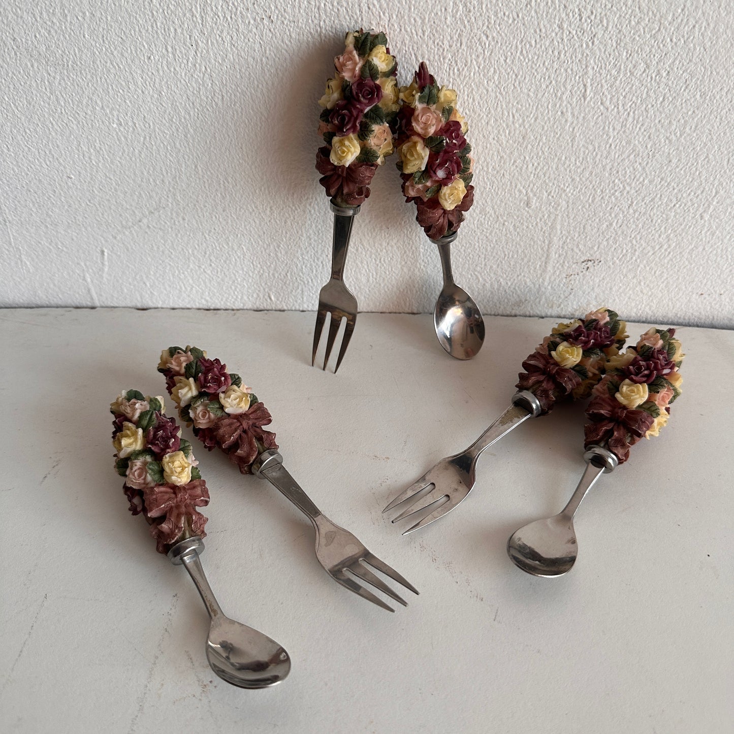 TT081 THREE SETS OF FLORAL HANDLE FORKS AND SPOONS