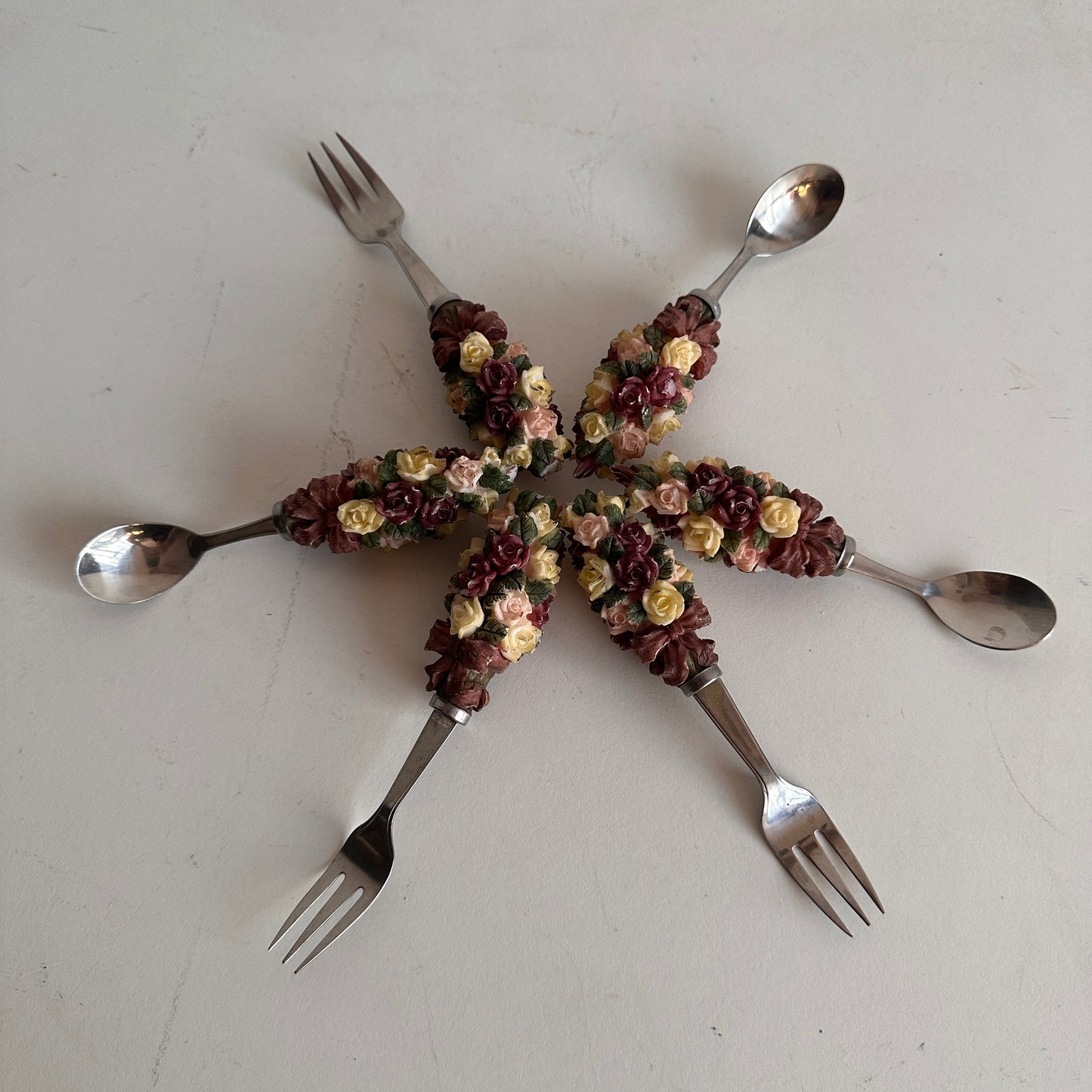 TT081 THREE SETS OF FLORAL HANDLE FORKS AND SPOONS