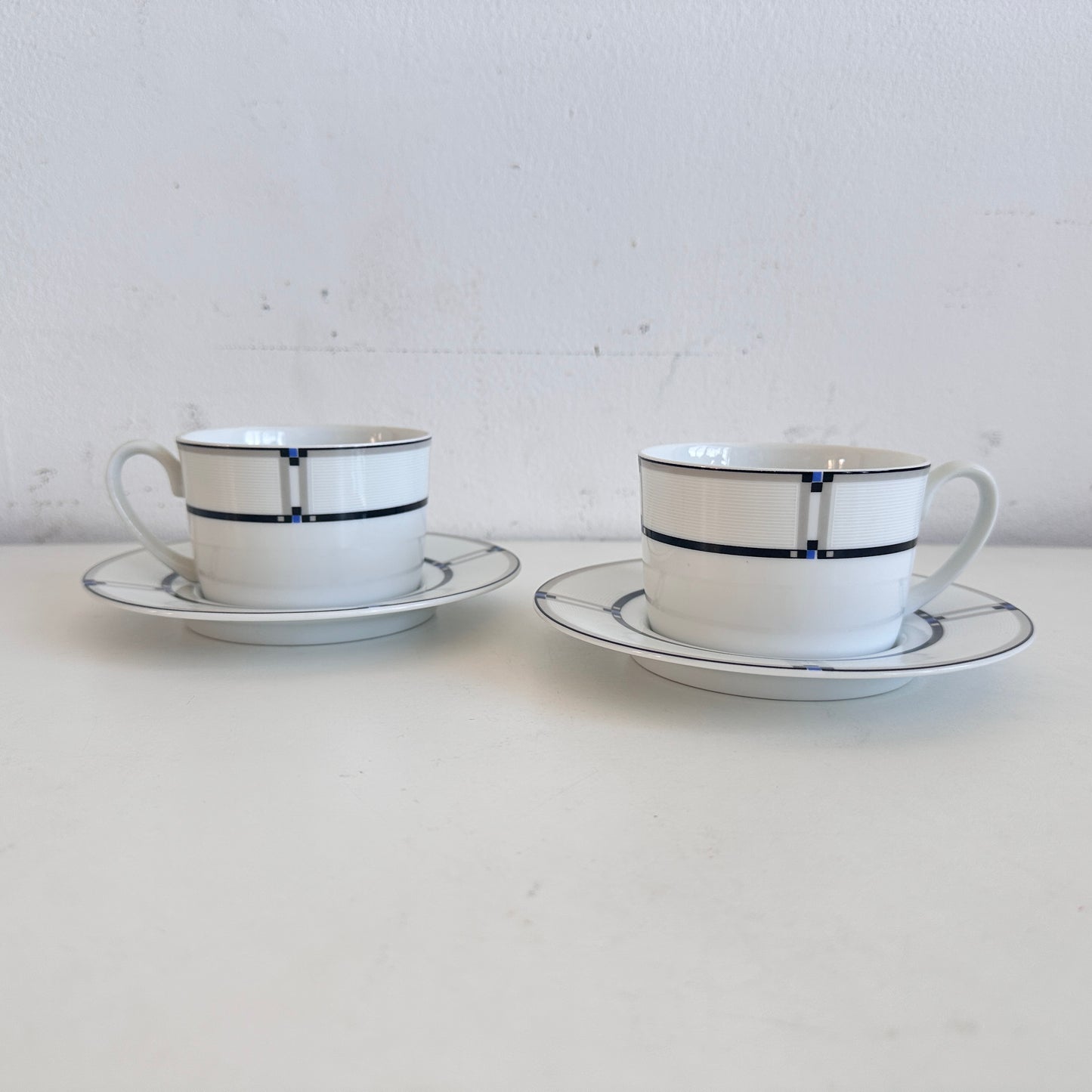 TT153 PAIR OF NOVA GEOMETRIC CUPS AND SAUCERS