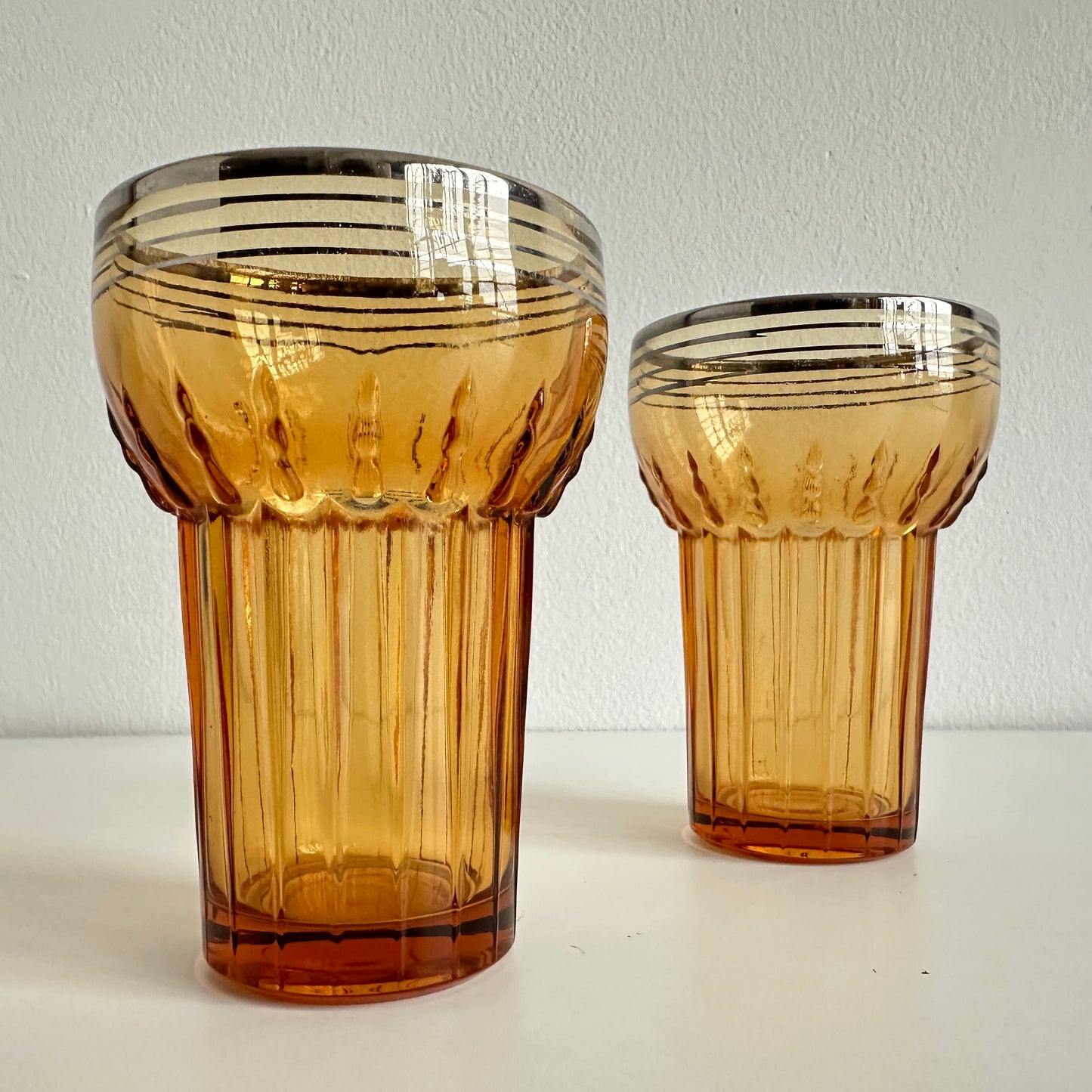 TT155 PAIR OF AMBER TUMBLERS WITH SILVER RIMS
