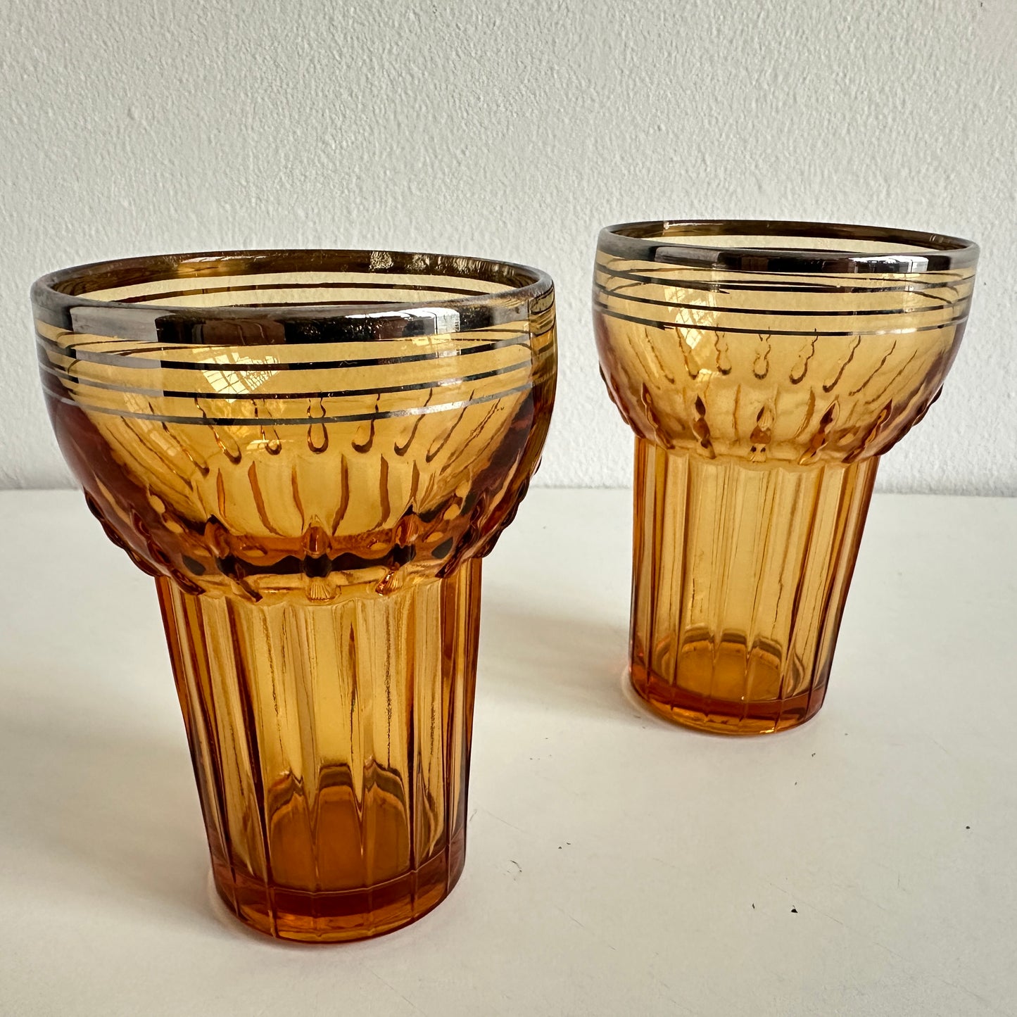 TT155 PAIR OF AMBER TUMBLERS WITH SILVER RIMS