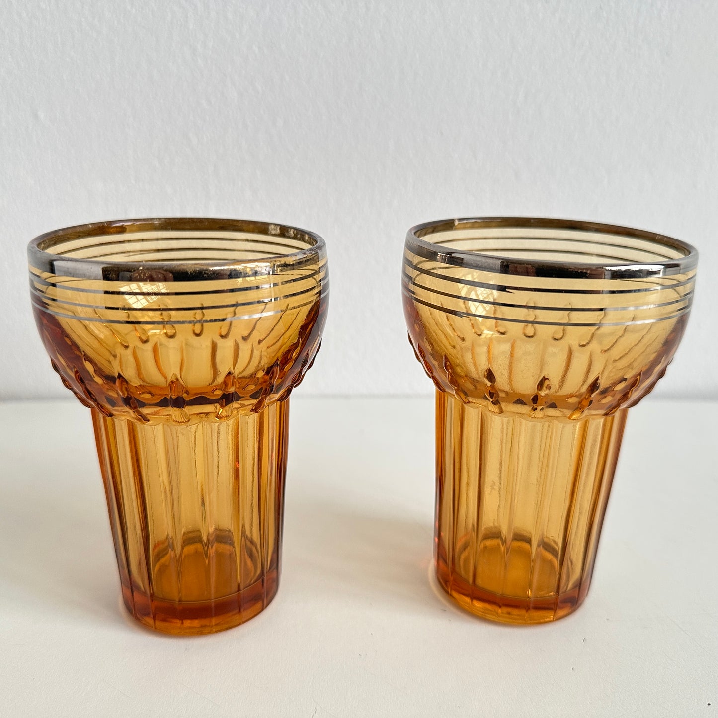 TT155 PAIR OF AMBER TUMBLERS WITH SILVER RIMS