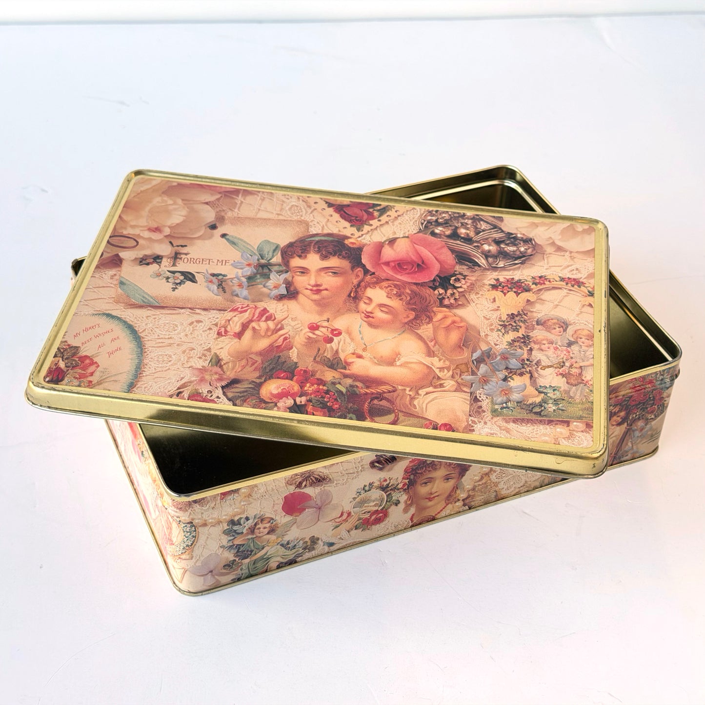 OB142 FLORAL CHERUB TIN